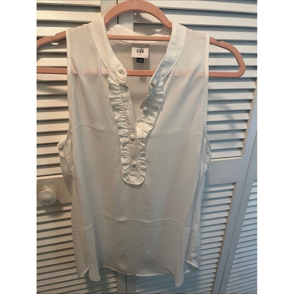 #2089**Cabi Sleeveless Ruffle Placket Top in Ivory